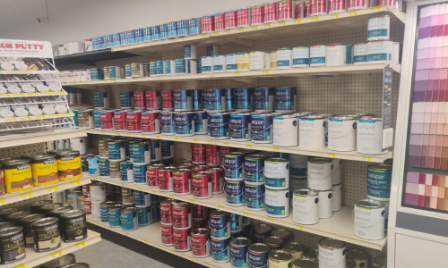Paint cans on display inside of Thedford Lumber.