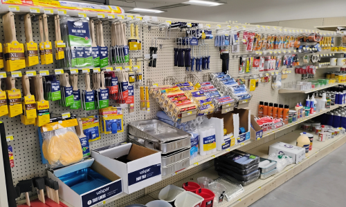 Paint and supplies on display inside of Thedford Lumber.